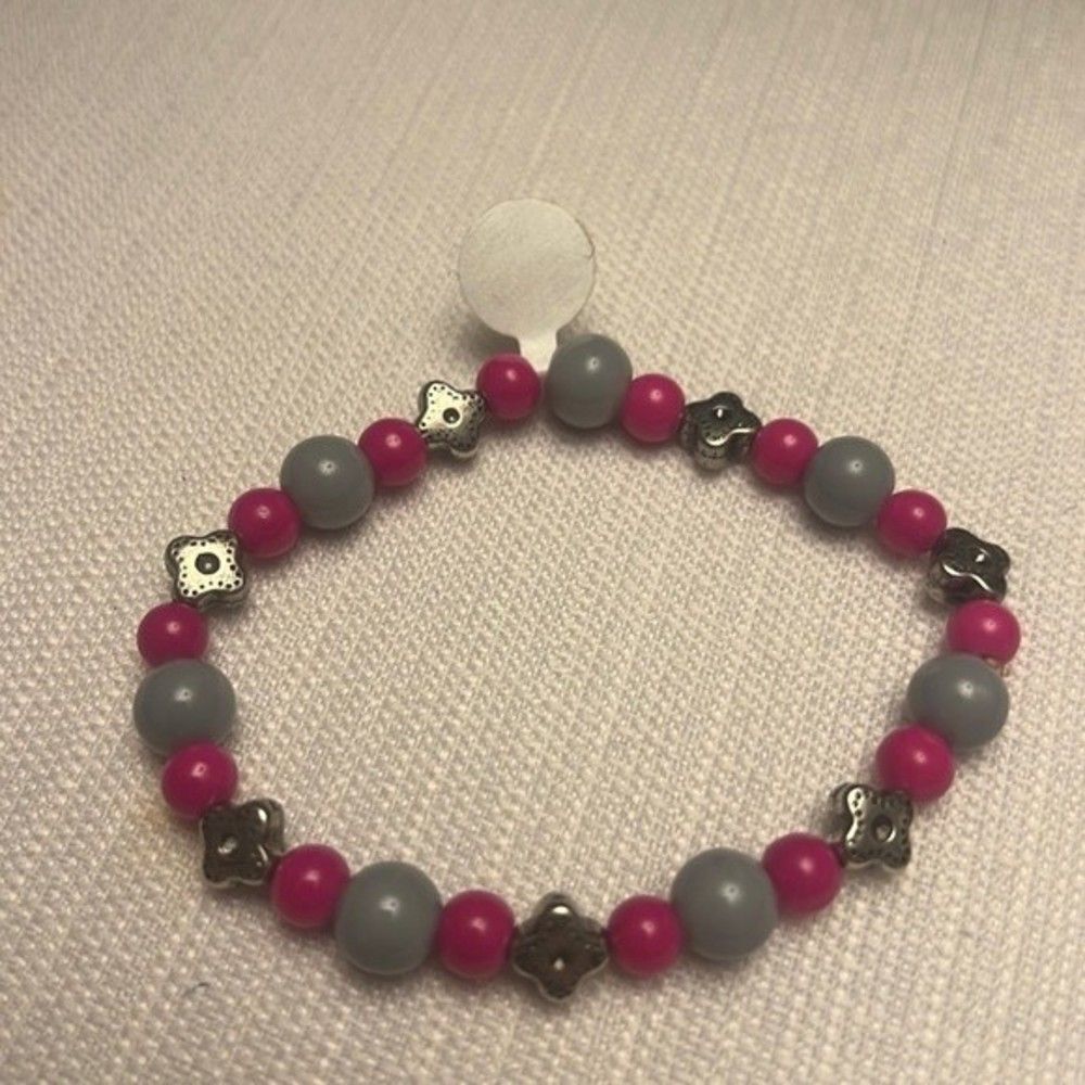 Handcrafted pink and grey glass bead bracelet with silver tone accents